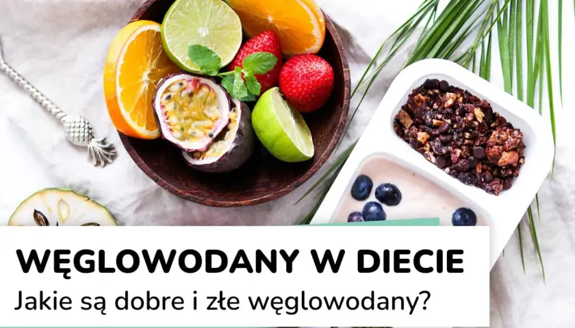 Kolorowe owoce i granola z jagodami. Zdjęcie ilustruje temat węglowodanów w diecie, pokazując ich zdrowe źródła.